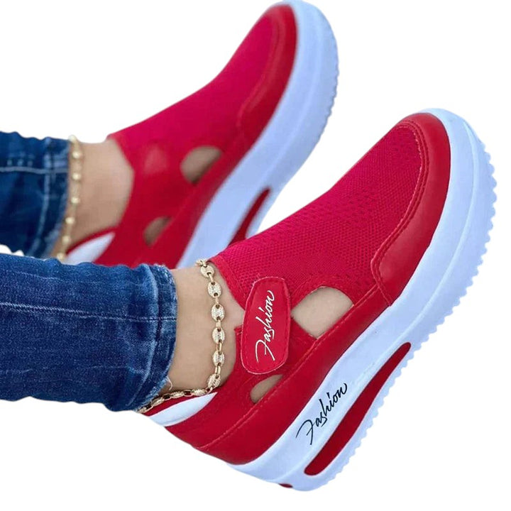 jardi-4 red knit slip-on trainers with side cutouts, platform sole, and heel pull tab worn with jeans